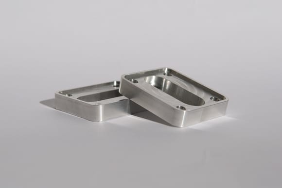 Machined stainless steel enclosure frames