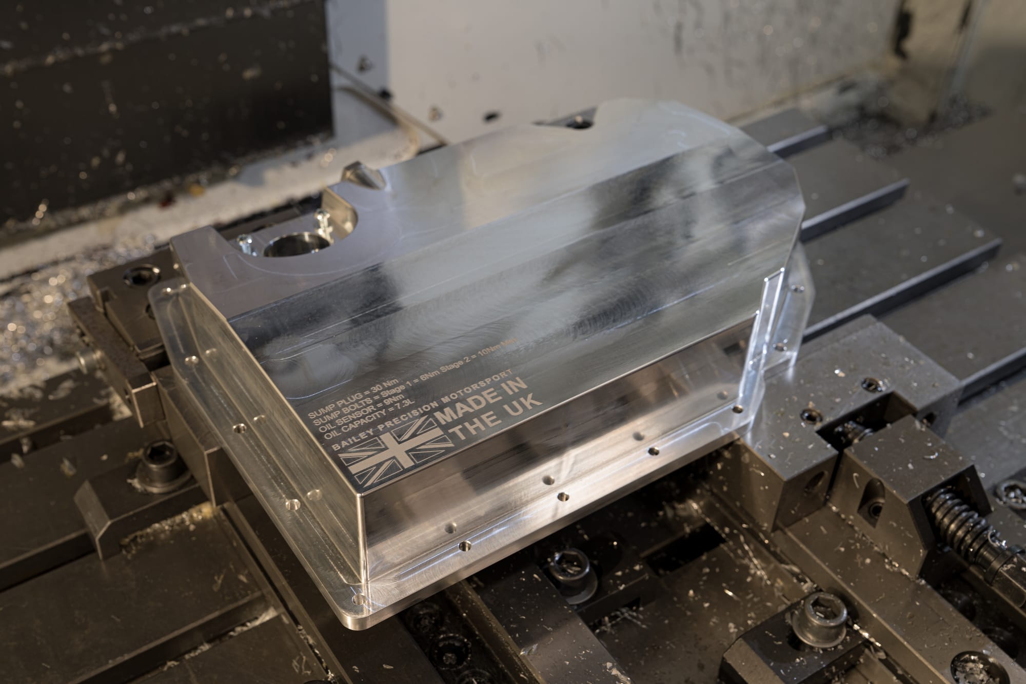 Billet aluminium motorsport sump with engraved service data